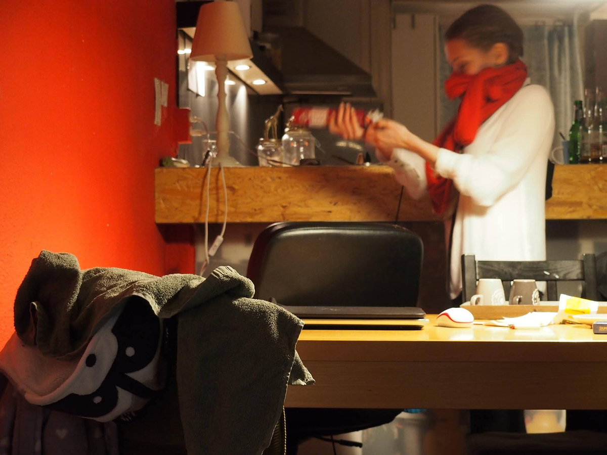 Red kitchen wall, red scarf, blurred motion